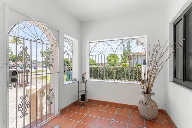 525 NW 32nd Ave, Miami, FL 33125 - unfurnished sunroom with plenty of natural light