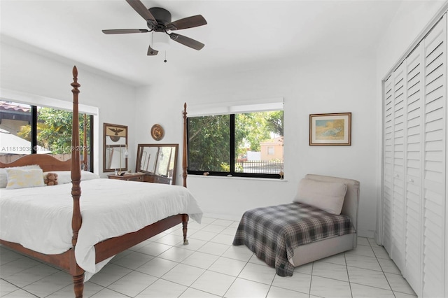 525 NW 32nd Ave, Miami, FL 33125 - bedroom with multiple windows, a ceiling fan, and light tile patterned floors