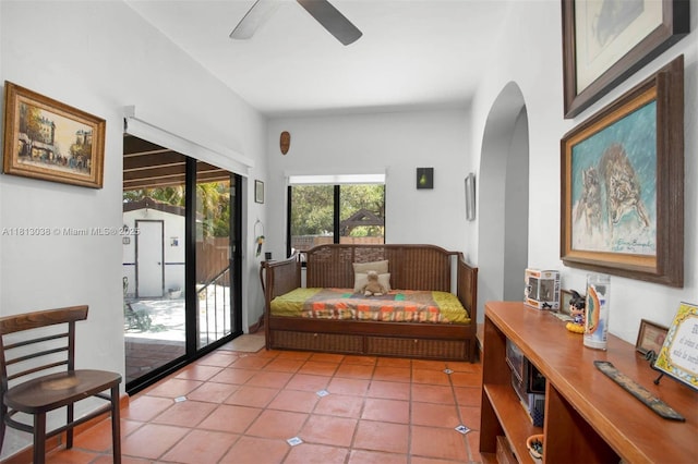 525 NW 32nd Ave, Miami, FL 33125 - living room featuring a ceiling fan, light tile patterned floors, and arched walkways
