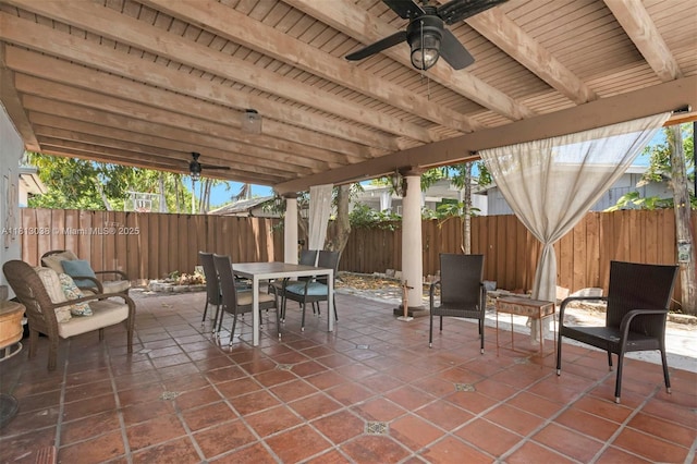 525 NW 32nd Ave, Miami, FL 33125 - fenced backyard featuring a ceiling fan, a patio, and outdoor dining area