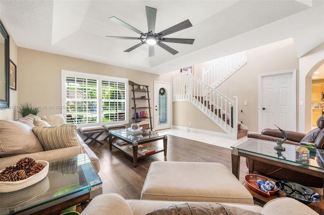 6459 Ungerer St, Jupiter, FL 33458 - living room with wood finished floors, arched walkways, stairs, and a ceiling fan