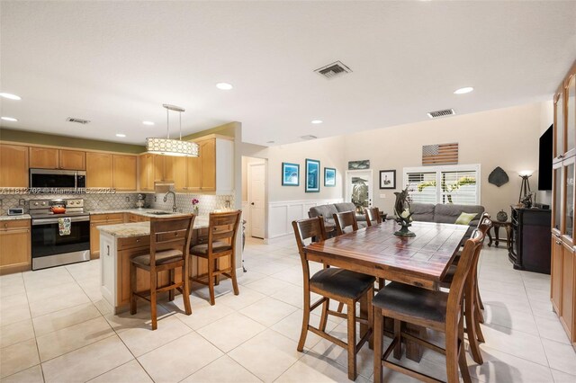 6459 Ungerer St, Jupiter, FL 33458 - dining room with recessed lighting and light tile patterned floors