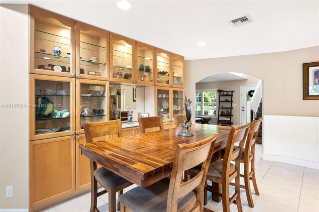 6459 Ungerer St, Jupiter, FL 33458 - dining area with arched walkways, light tile patterned floors, and recessed lighting