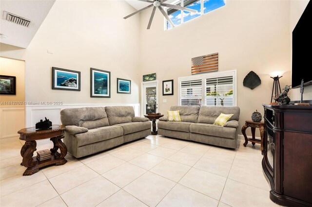 6459 Ungerer St, Jupiter, FL 33458 - living area with a towering ceiling, a ceiling fan, and light tile patterned floors