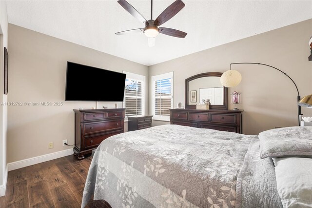 6459 Ungerer St, Jupiter, FL 33458 - bedroom featuring dark wood-type flooring, baseboards, and a ceiling fan