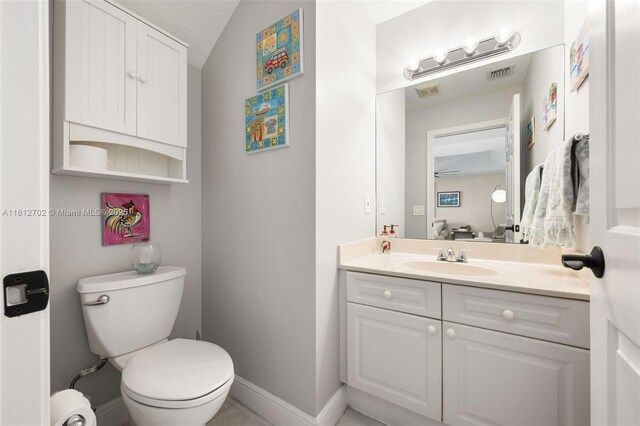 6459 Ungerer St, Jupiter, FL 33458 - bathroom with vanity, toilet, and baseboards