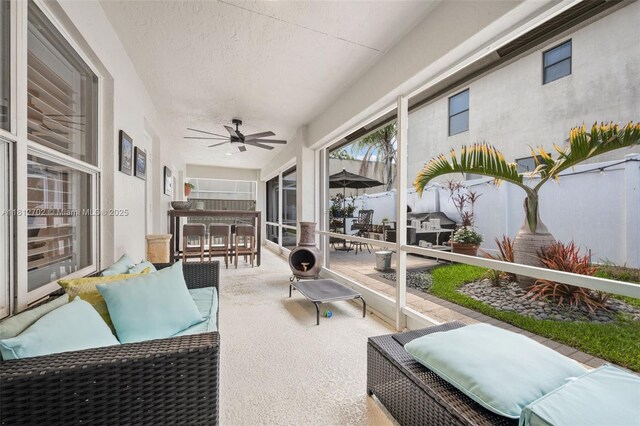 6459 Ungerer St, Jupiter, FL 33458 - sunroom featuring outdoor dining space, an outdoor living space, and ceiling fan