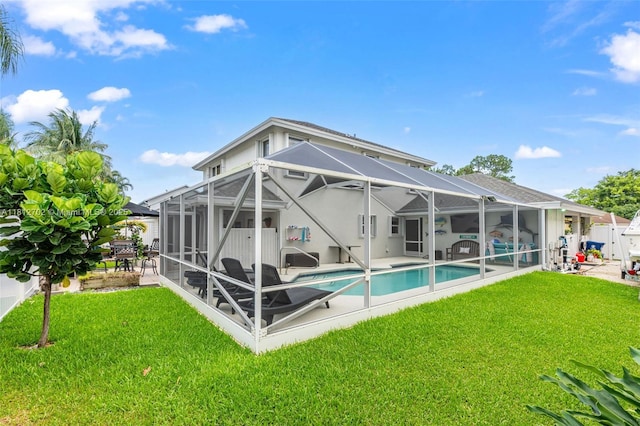 6459 Ungerer St, Jupiter, FL 33458 - rear view of property featuring a patio area, an outdoor pool, and a lanai