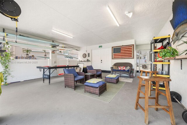 6459 Ungerer St, Jupiter, FL 33458 - living area featuring a textured ceiling and concrete flooring