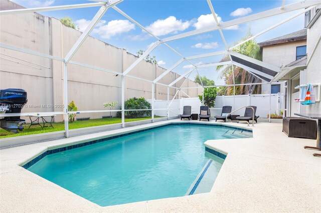 6459 Ungerer St, Jupiter, FL 33458 - view of pool featuring a patio area and glass enclosure