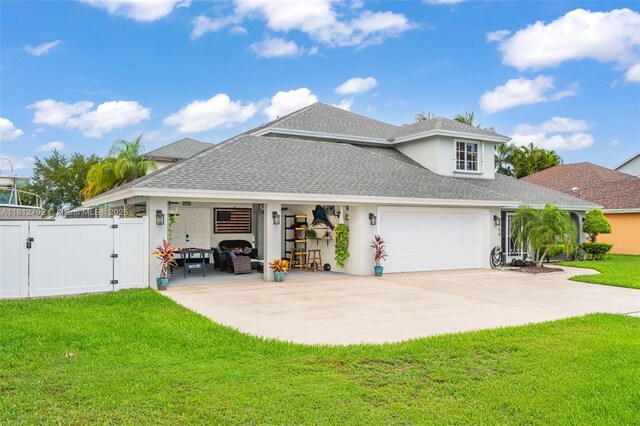 6459 Ungerer St, Jupiter, FL 33458 - view of front facade featuring a gate, roof with shingles, driveway, and stucco siding