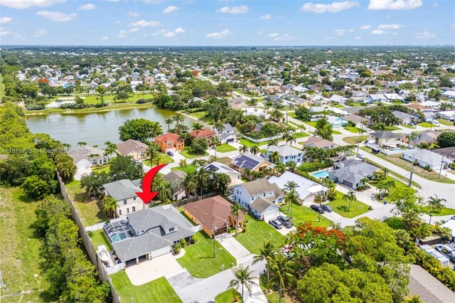 6459 Ungerer St, Jupiter, FL 33458 - aerial view of property and surrounding area featuring a nearby body of water and nearby suburban area