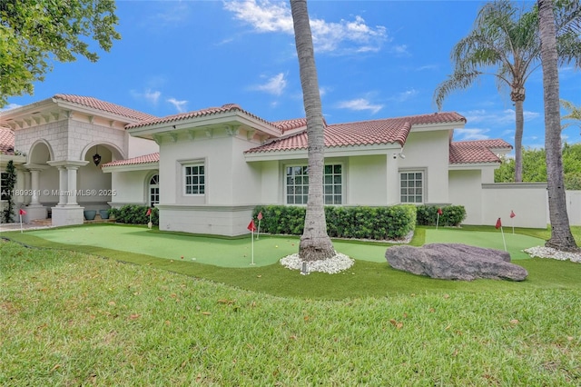 5963 NW 75th Way, Parkland, FL 33067 - back of property featuring a putting area, a tile roof, stucco siding, and a lawn