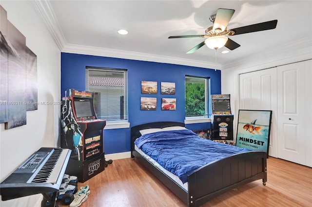 5963 NW 75th Way, Parkland, FL 33067 - bedroom featuring wood finished floors, ornamental molding, a closet, ceiling fan, and recessed lighting