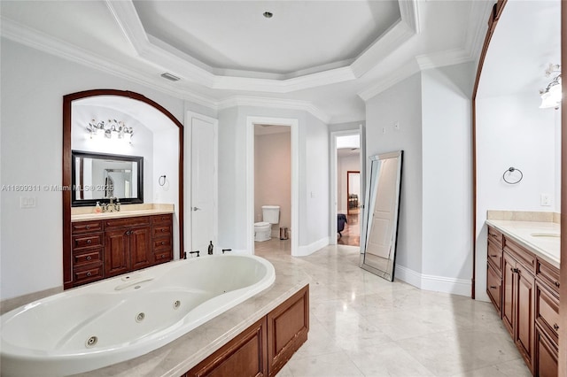 5963 NW 75th Way, Parkland, FL 33067 - bathroom with toilet, vanity, a jetted tub, ornamental molding, and a raised ceiling