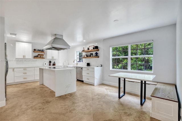 5963 NW 75th Way, Parkland, FL 33067 - kitchen featuring open shelves, island exhaust hood, stainless steel dishwasher, light countertops, and white cabinetry