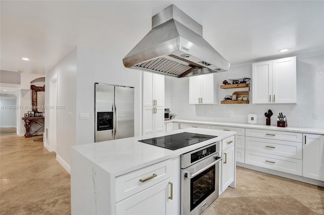 5963 NW 75th Way, Parkland, FL 33067 - kitchen featuring island exhaust hood, stainless steel appliances, white cabinets, tasteful backsplash, and open shelves
