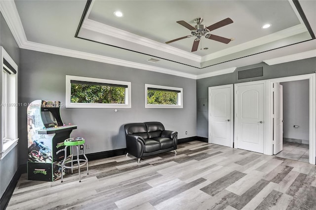5963 NW 75th Way, Parkland, FL 33067 - living area with a raised ceiling, ceiling fan, wood finished floors, baseboards, and ornamental molding
