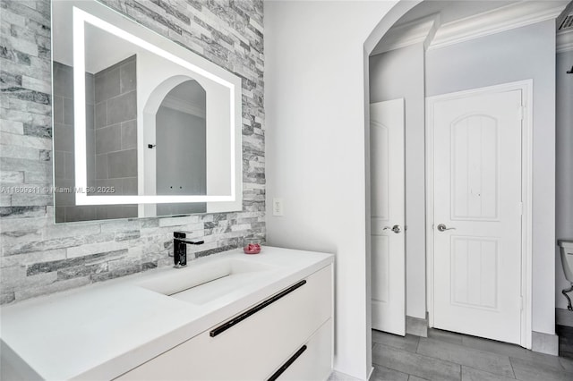 5963 NW 75th Way, Parkland, FL 33067 - bathroom featuring vanity, ornamental molding, and tasteful backsplash