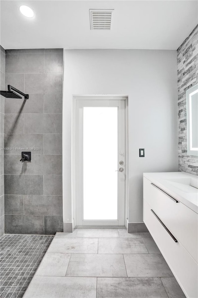 5963 NW 75th Way, Parkland, FL 33067 - bathroom featuring vanity, tiled shower, and recessed lighting