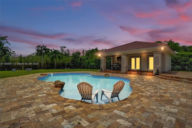 5963 NW 75th Way, Parkland, FL 33067 - swimming pool with a storage structure, a patio, an outbuilding, and french doors