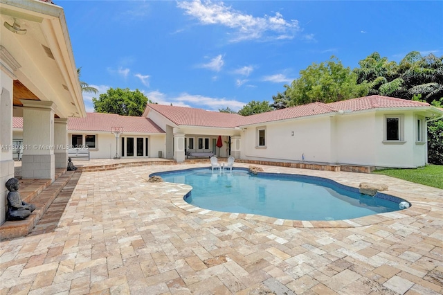 5963 NW 75th Way, Parkland, FL 33067 - swimming pool with a patio area and french doors