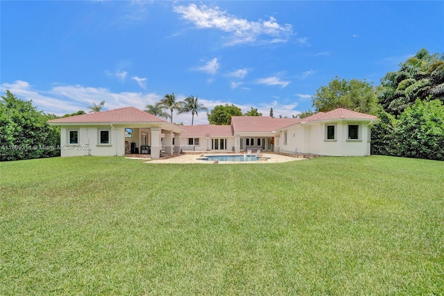 5963 NW 75th Way, Parkland, FL 33067 - rear view of house featuring a patio, a tile roof, an outdoor pool, and a yard