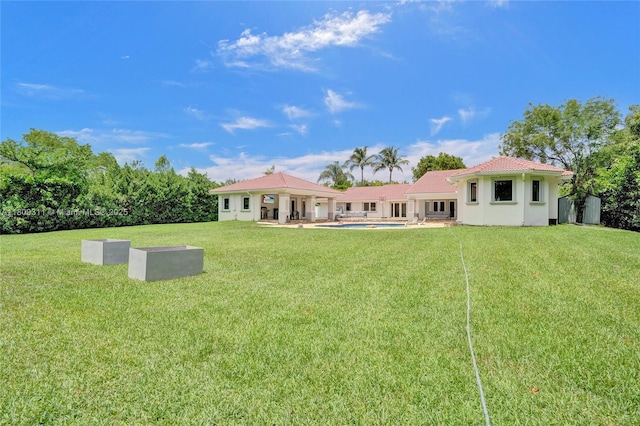 5963 NW 75th Way, Parkland, FL 33067 - rear view of property with an outdoor pool, a yard, a patio, and stucco siding