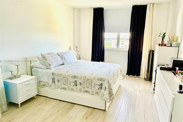 1455 N Treasure Dr Unit 6C, North Bay Village, FL 33141 - bedroom with light wood-style floors