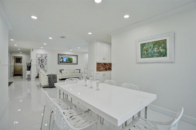 8438 NW 26th Dr, Coral Springs, FL 33065 - dining space with recessed lighting and crown molding