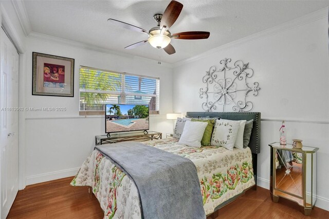 8438 NW 26th Dr, Coral Springs, FL 33065 - bedroom with wood finished floors, crown molding, and ceiling fan