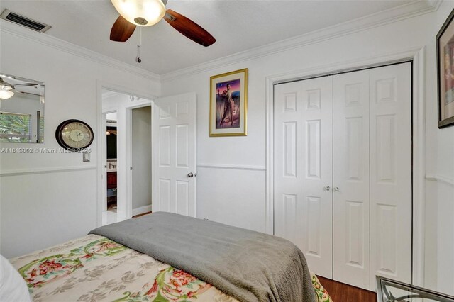 8438 NW 26th Dr, Coral Springs, FL 33065 - bedroom with crown molding, dark wood finished floors, a closet, and a ceiling fan