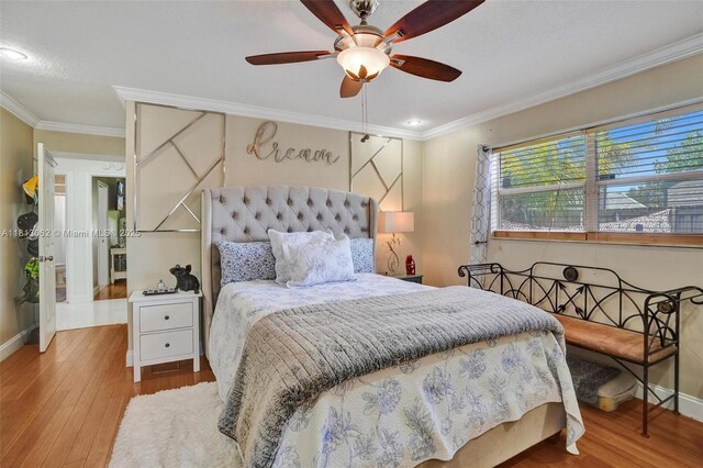 8438 NW 26th Dr, Coral Springs, FL 33065 - bedroom with crown molding, wood finished floors, and a ceiling fan