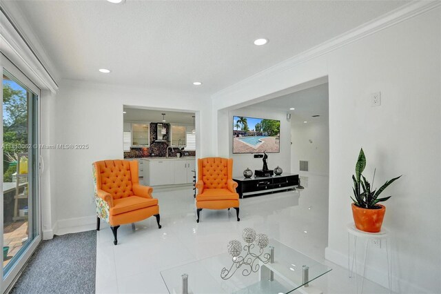 8438 NW 26th Dr, Coral Springs, FL 33065 - sitting room featuring recessed lighting, ornamental molding, and tile patterned floors
