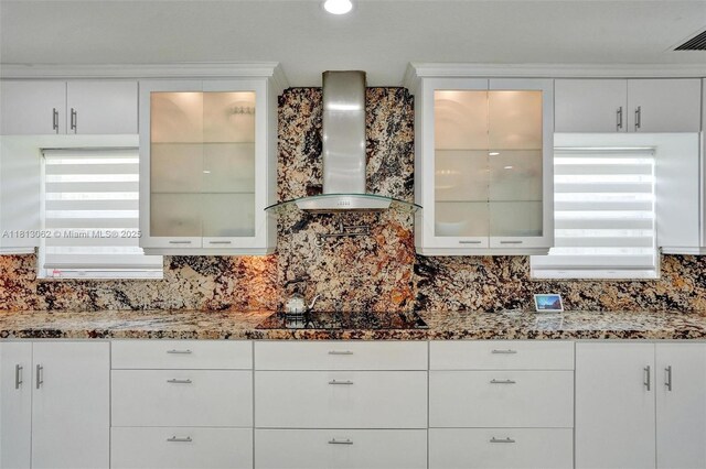 8438 NW 26th Dr, Coral Springs, FL 33065 - kitchen with wall chimney exhaust hood, plenty of natural light, black stovetop, and backsplash