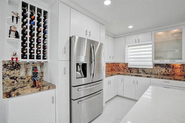 8438 NW 26th Dr, Coral Springs, FL 33065 - kitchen featuring stainless steel fridge, backsplash, white cabinetry, glass insert cabinets, and recessed lighting