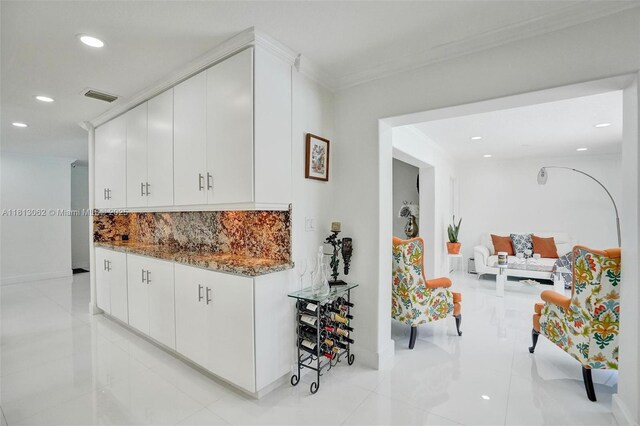 8438 NW 26th Dr, Coral Springs, FL 33065 - bar area with recessed lighting, tasteful backsplash, light tile patterned floors, and crown molding