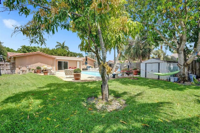 8438 NW 26th Dr, Coral Springs, FL 33065 - fenced backyard with a storage shed