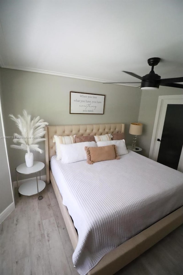 11613 N 42nd Rd N, West Palm Beach, FL 33411 - bedroom featuring crown molding, light wood-type flooring, ceiling fan, and baseboards