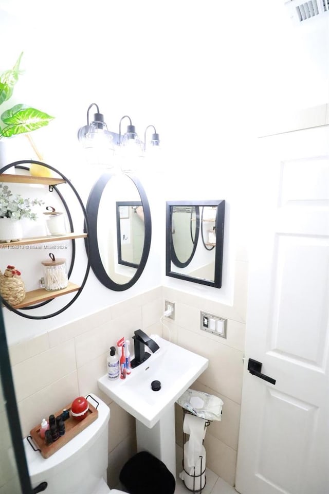 11613 N 42nd Rd N, West Palm Beach, FL 33411 - half bathroom with tile walls and toilet