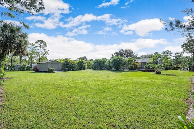 11613 N 42nd Rd N, West Palm Beach, FL 33411 - view of grassy yard featuring an outbuilding and a detached garage
