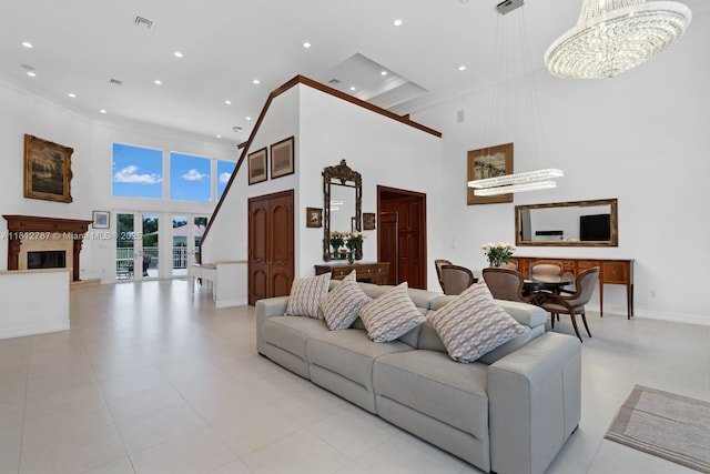 4241 NE 23rd Ter, Lighthouse Point, FL 33064 - living room with a towering ceiling, recessed lighting, a high end fireplace, a chandelier, and ornamental molding