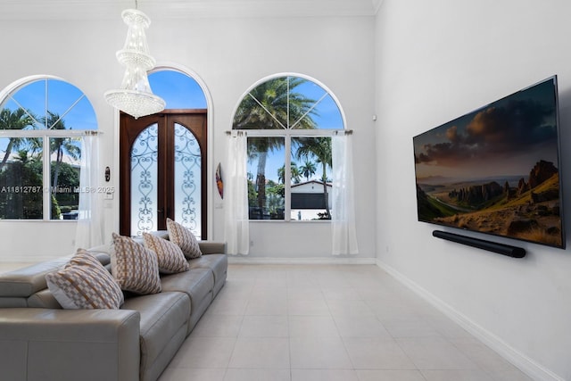 4241 NE 23rd Ter, Lighthouse Point, FL 33064 - living room featuring tile patterned flooring and a towering ceiling