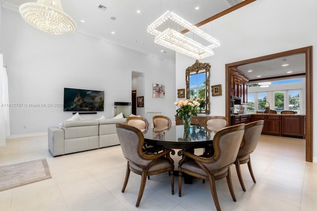 4241 NE 23rd Ter, Lighthouse Point, FL 33064 - dining room featuring a chandelier, ornamental molding, a high ceiling, healthy amount of natural light, and recessed lighting