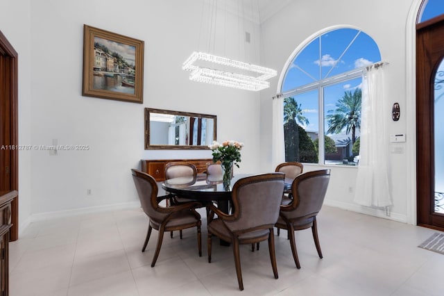 4241 NE 23rd Ter, Lighthouse Point, FL 33064 - dining space featuring a chandelier and a high ceiling