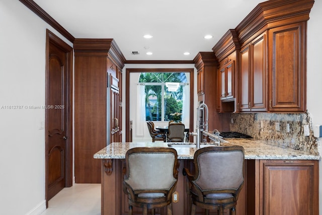 4241 NE 23rd Ter, Lighthouse Point, FL 33064 - kitchen with light stone counters, crown molding, a peninsula, backsplash, and recessed lighting