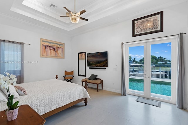 4241 NE 23rd Ter, Lighthouse Point, FL 33064 - bedroom with access to exterior, french doors, crown molding, a tray ceiling, and tile patterned flooring