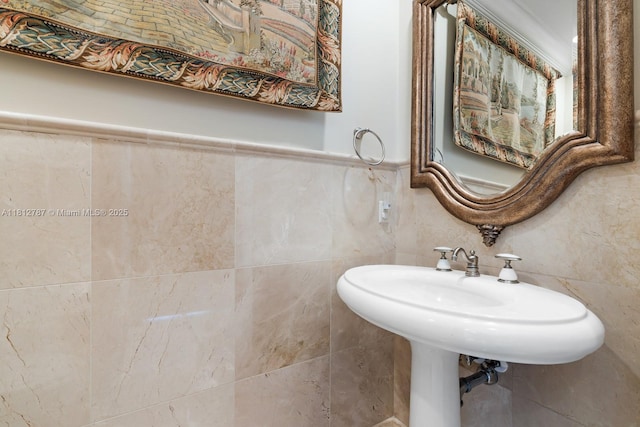4241 NE 23rd Ter, Lighthouse Point, FL 33064 - bathroom featuring tile walls and wainscoting