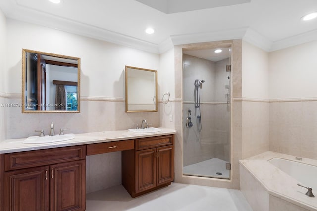 4241 NE 23rd Ter, Lighthouse Point, FL 33064 - full bath featuring double vanity, a stall shower, a garden tub, tile walls, and recessed lighting