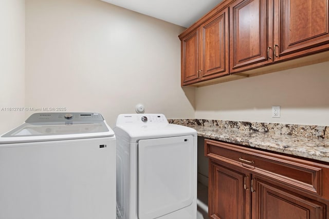 4241 NE 23rd Ter, Lighthouse Point, FL 33064 - laundry room with cabinet space and independent washer and dryer
